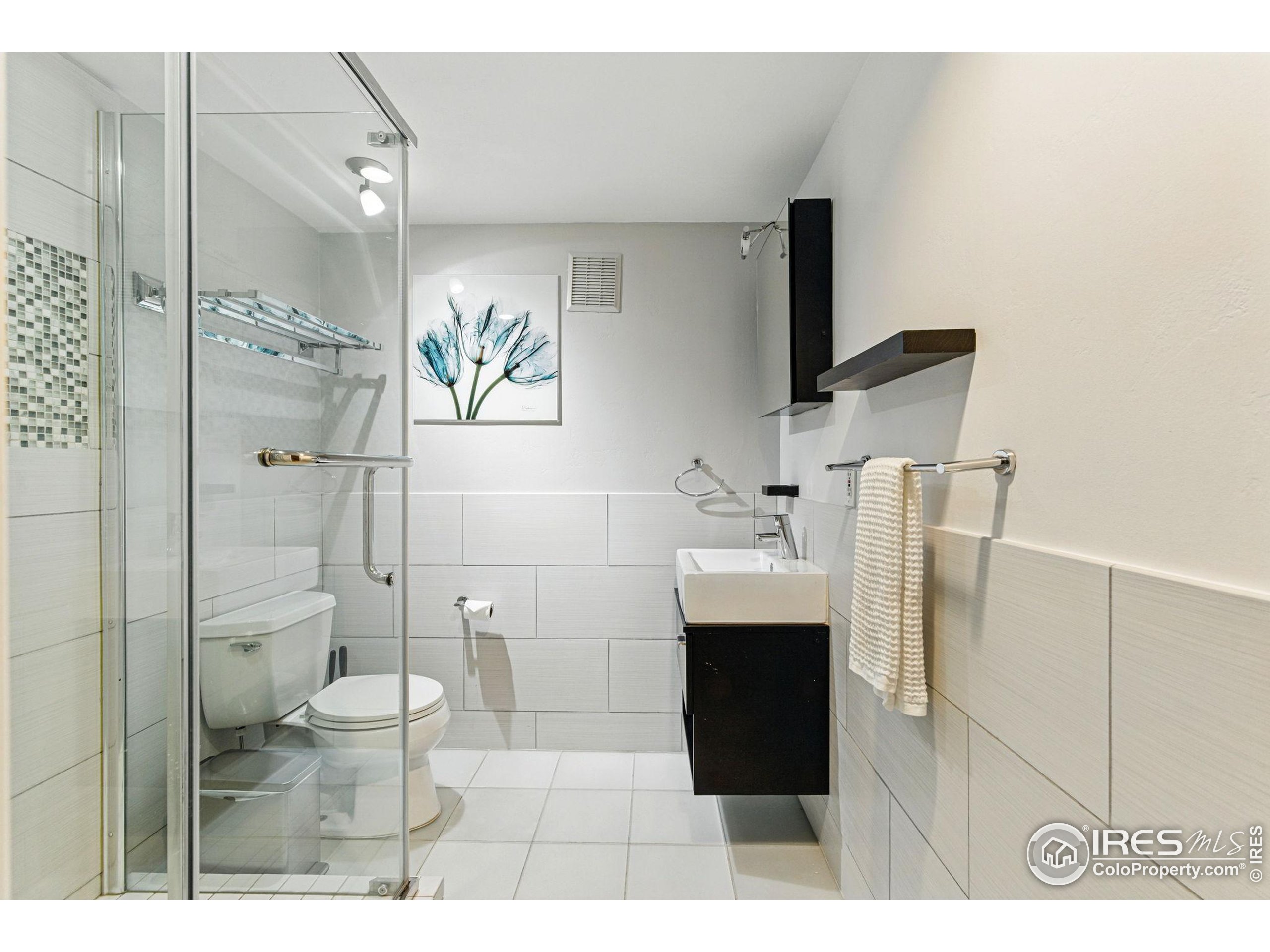 182 Ridge Road Boulder, CO 80303 - Photo 12 of 43 a bathroom with a sink a toilet and shower