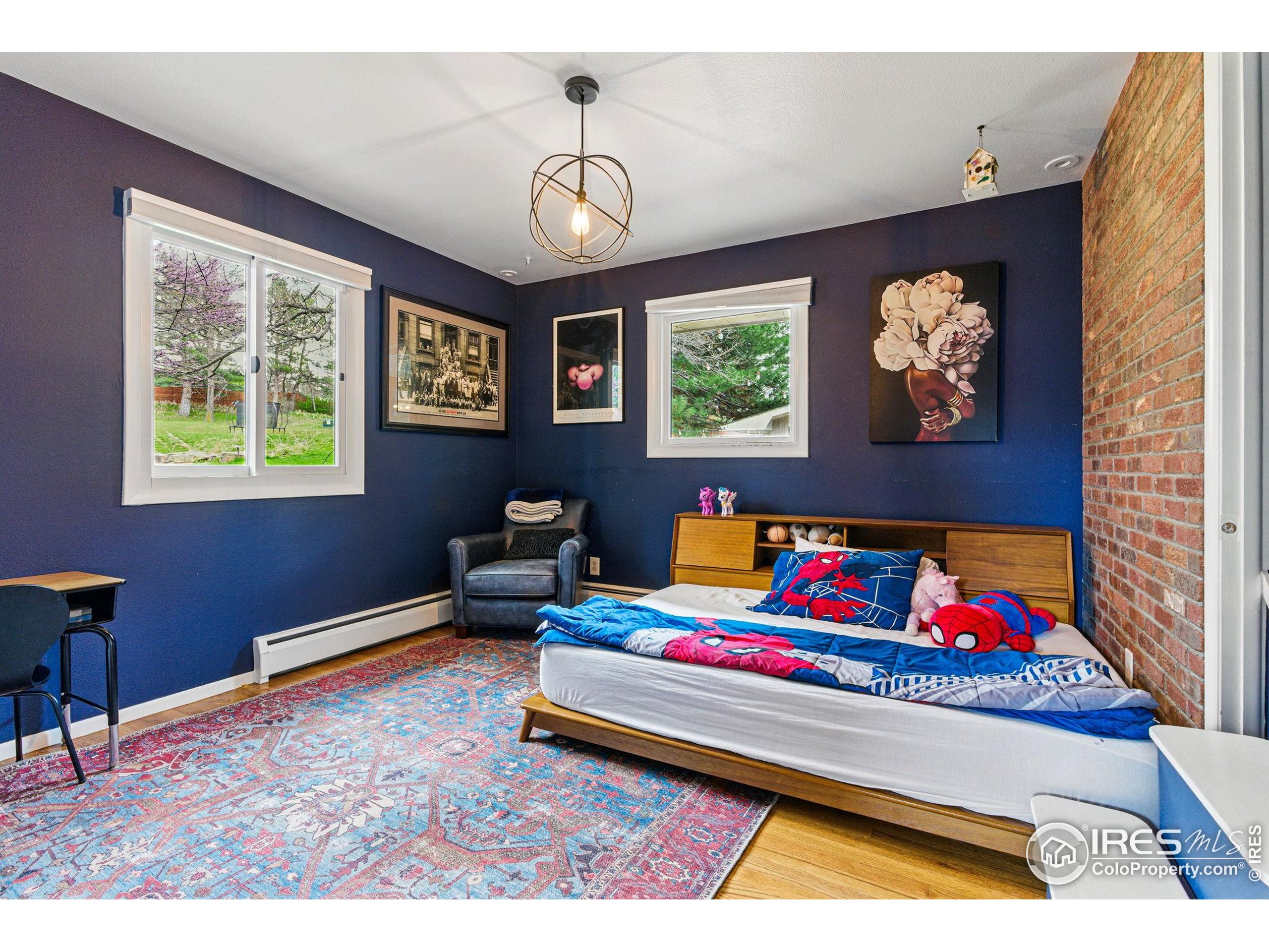 182 Ridge Road Boulder, CO 80303 - Photo 17 of 43 a bedroom with furniture and a window