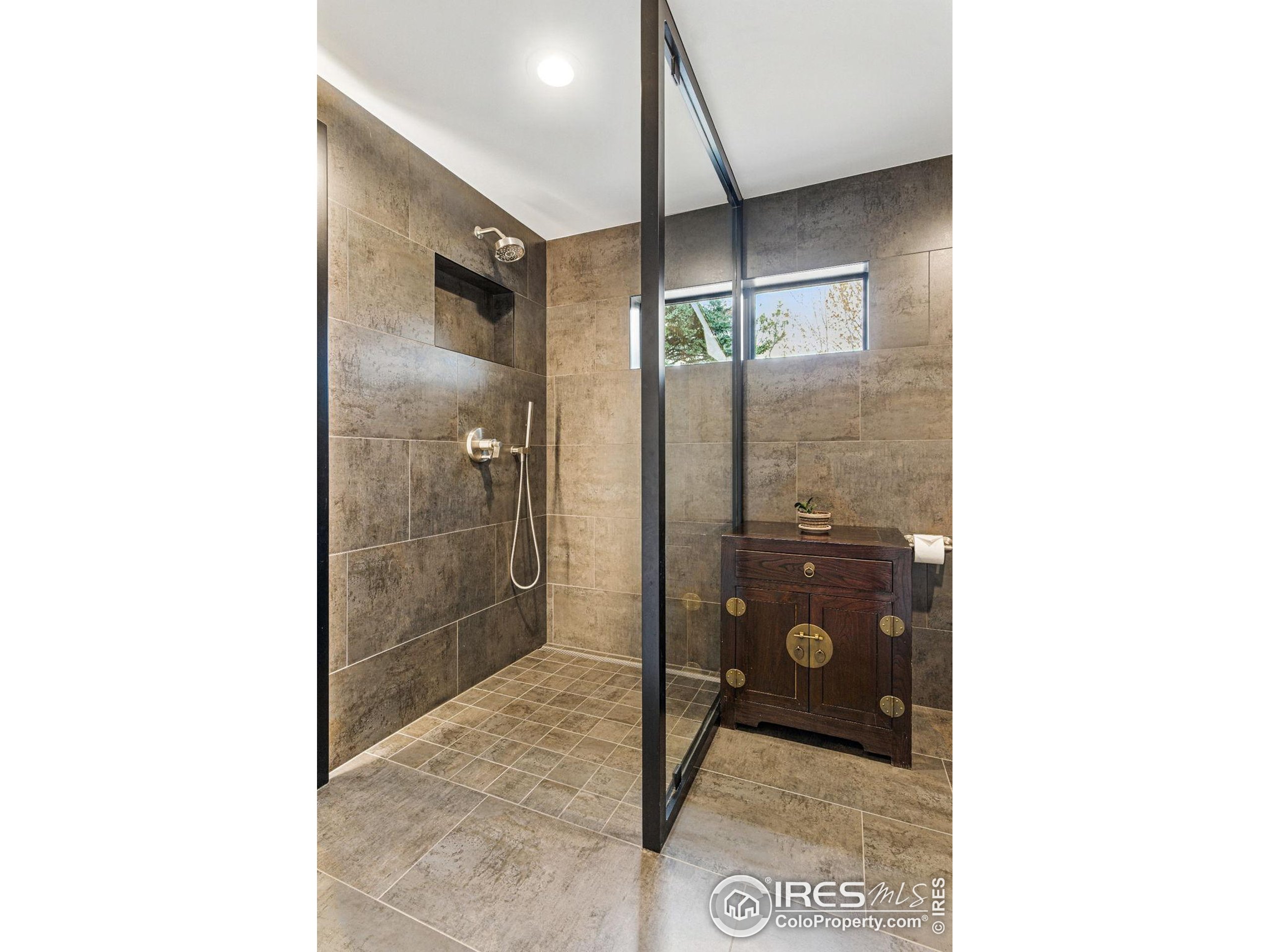 182 Ridge Road Boulder, CO 80303 - Photo 19 of 43 a bathroom with a shower and a sink