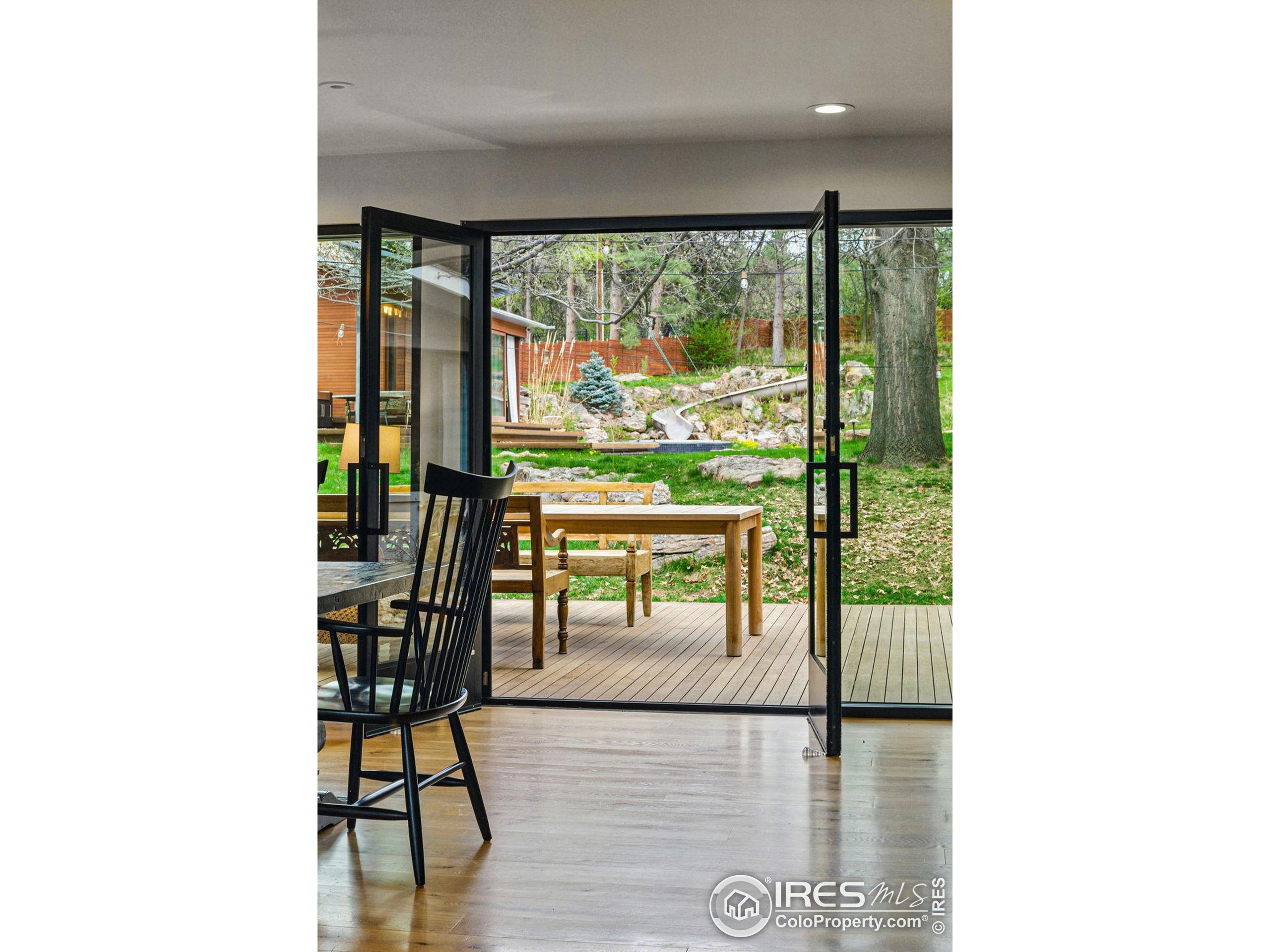 182 Ridge Road Boulder, CO 80303 - Photo 23 of 43 a living room with furniture and a floor to ceiling window