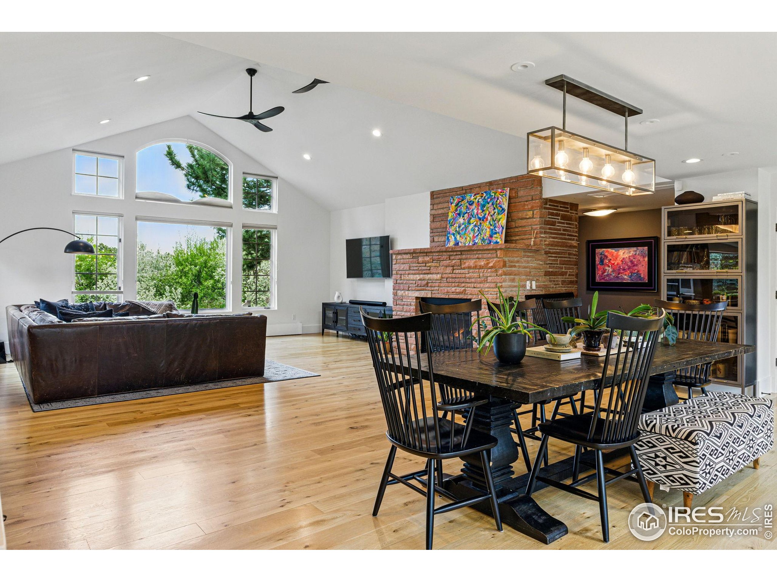 182 Ridge Road Boulder, CO 80303 - Photo 27 of 43 a view of a dining room with furniture and wooden floor