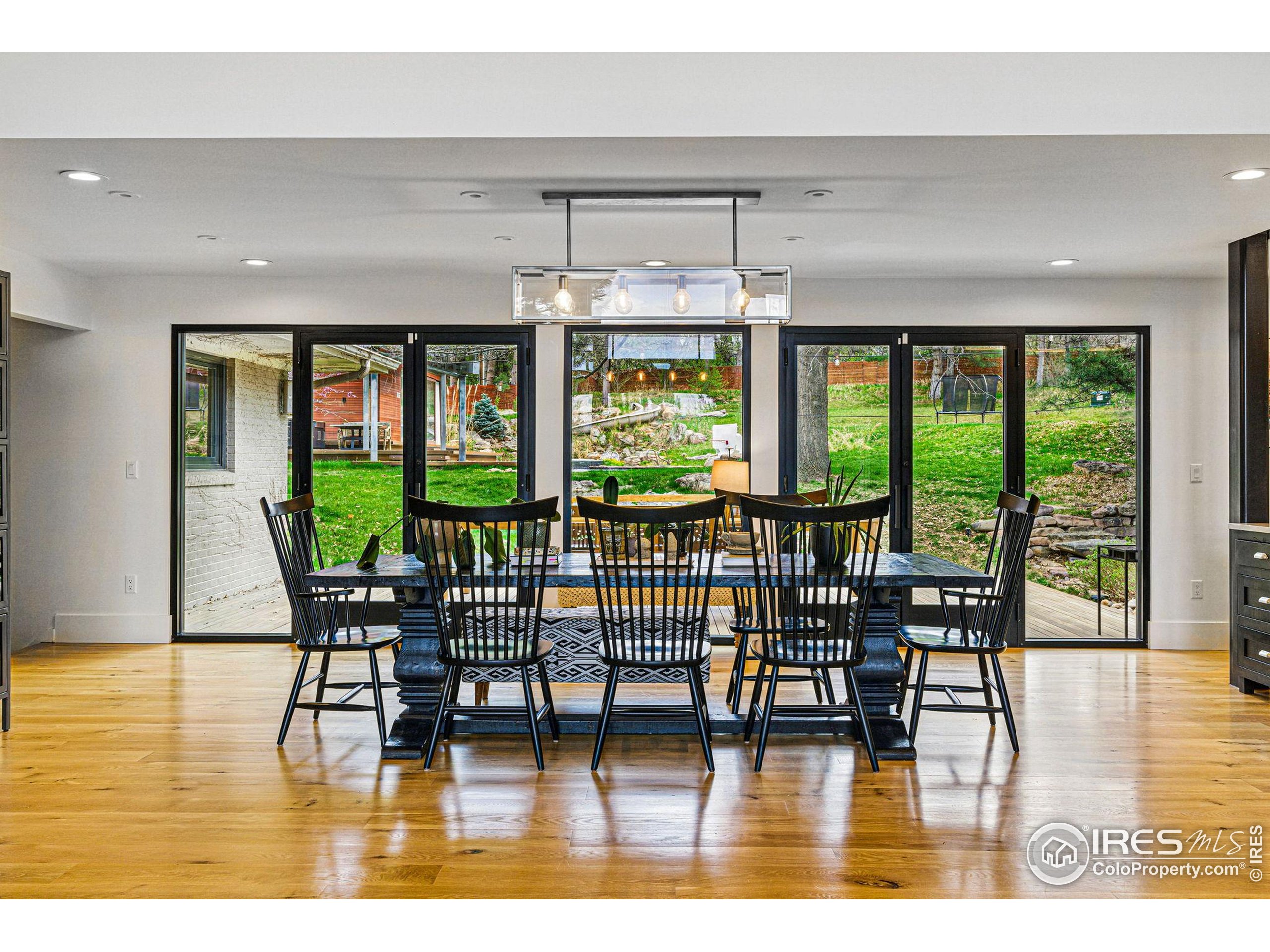 182 Ridge Road Boulder, CO 80303 - Photo 32 of 43 a view of a dining room with furniture window and wooden floor