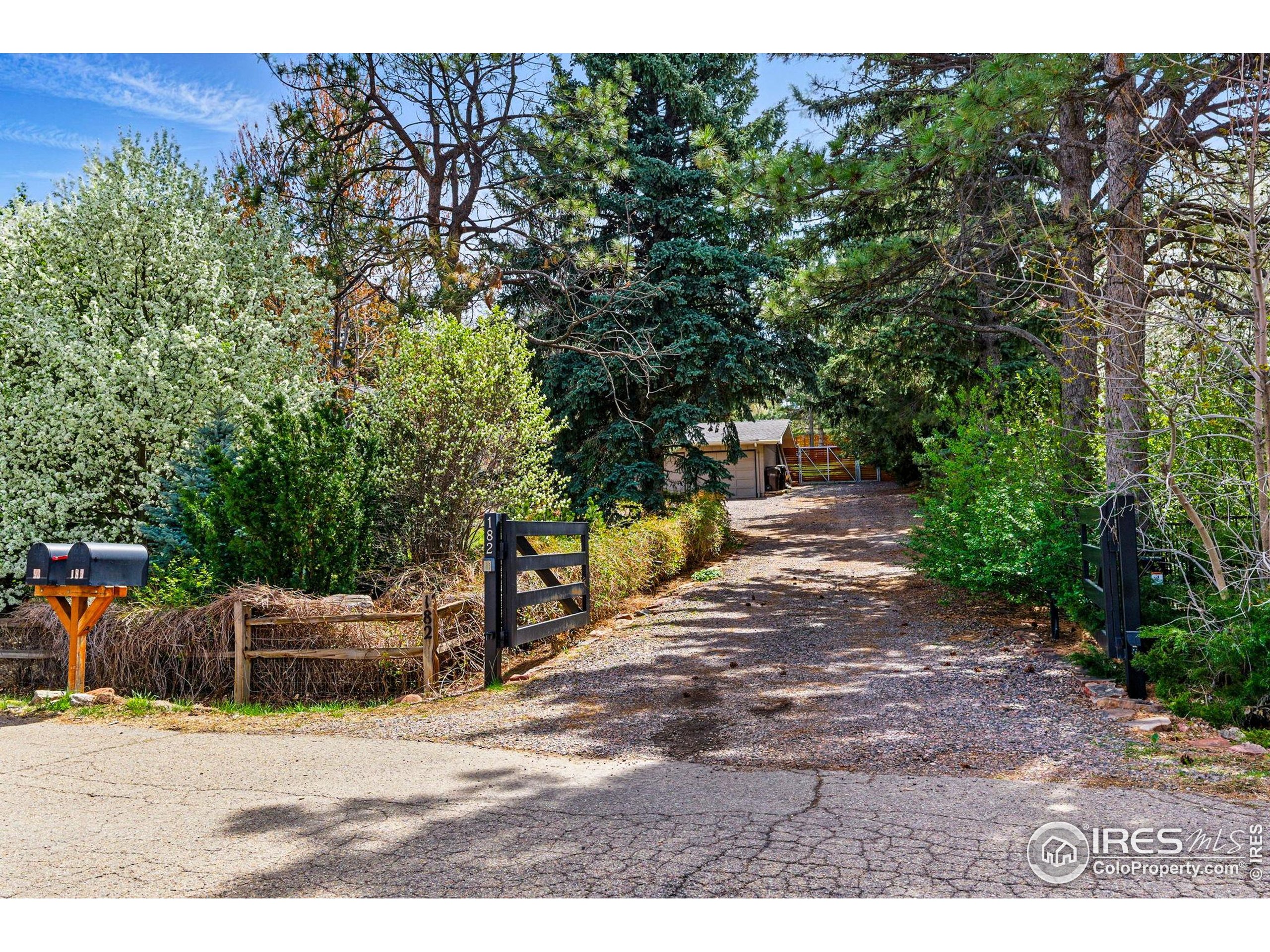 182 Ridge Road Boulder, CO 80303 - Photo 39 of 43 a backyard of a house with yard and outdoor seating