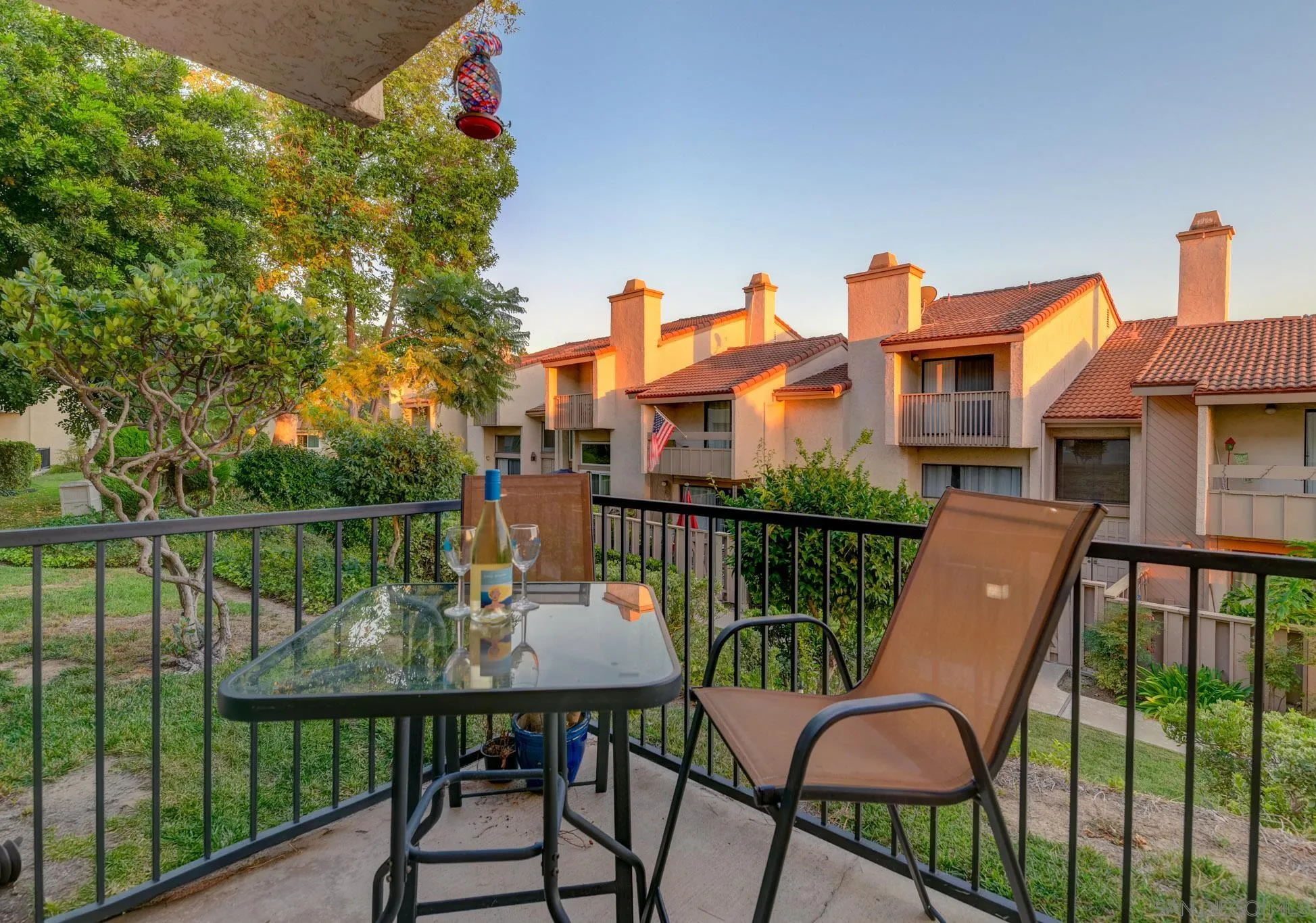 6877 Caminito Mundo, Unit 25 San Diego, CA 92119 - Photo 13 of 28 a balcony with table and chairs