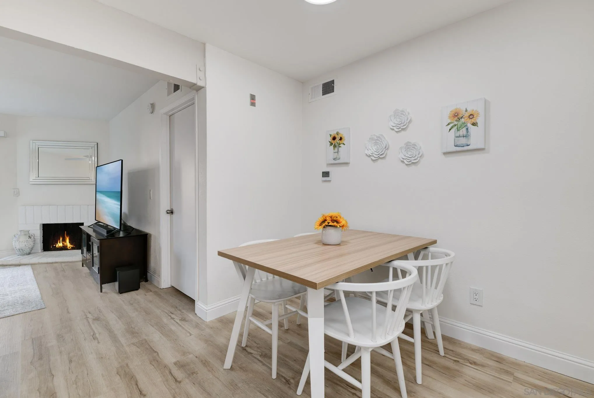 6877 Caminito Mundo, Unit 25 San Diego, CA 92119 - Photo 2 of 28 a view of a dining room with furniture and wooden floor