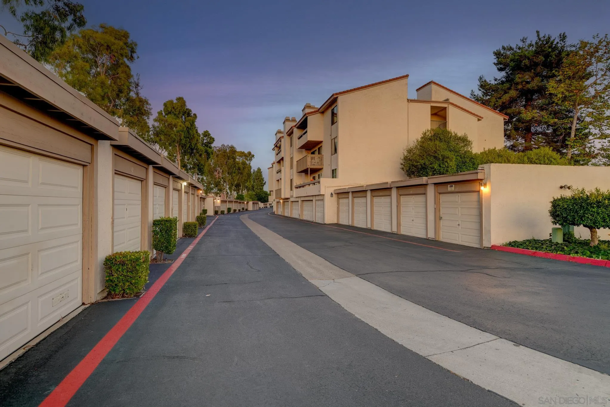 6877 Caminito Mundo, Unit 25 San Diego, CA 92119 - Photo 23 of 28 a view of a house with a street