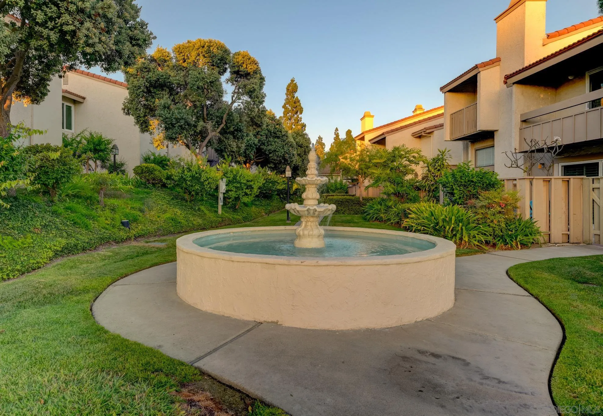 6877 Caminito Mundo, Unit 25 San Diego, CA 92119 - Photo 27 of 28 a view of a fountain in front of a house