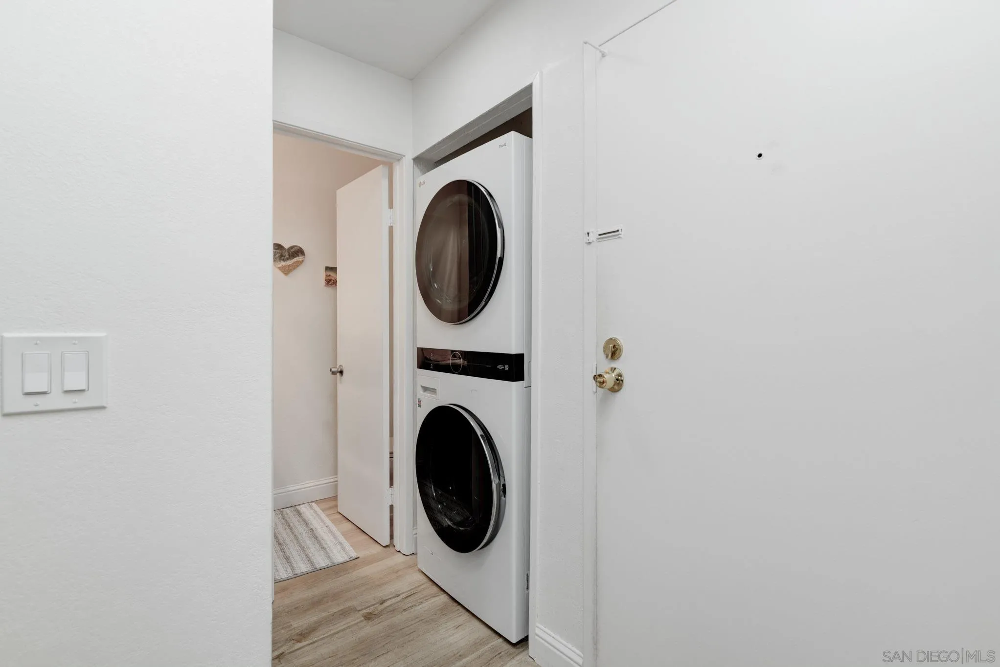 6877 Caminito Mundo, Unit 25 San Diego, CA 92119 - Photo 4 of 28 a utility room with dryer and washer