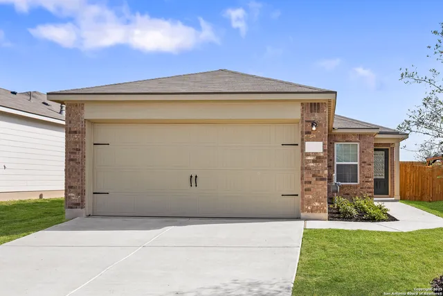 a view of garage and yard