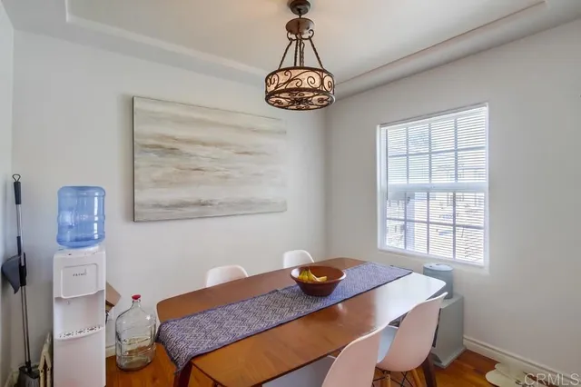a dining room with a table and chairs