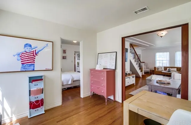 a view of a bedroom with workspace and bedroom
