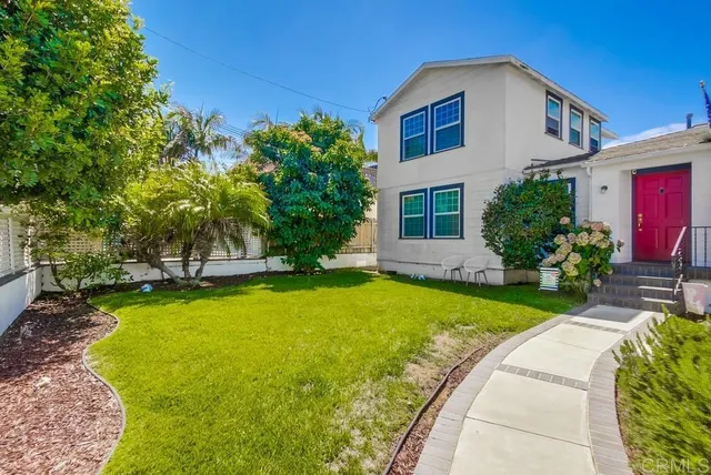 a view of a house with pool and sitting area