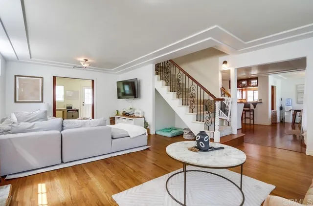 a living room with furniture and a table