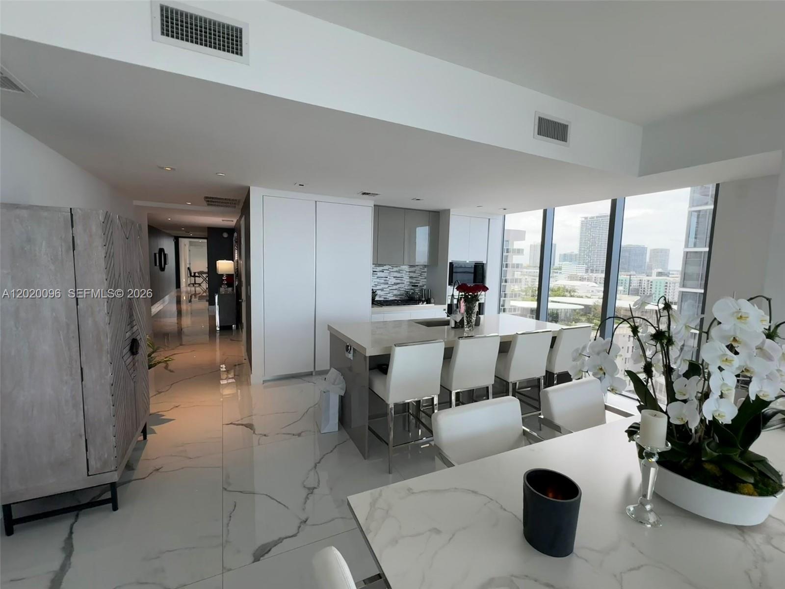 788 Northeast 23rd Street, Unit 1202 Miami, FL 33137 - Photo 11 of 64 a living room with furniture and a large window