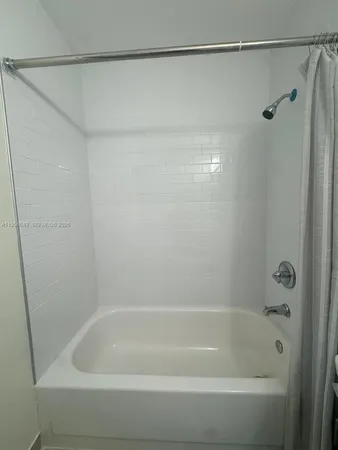 a close view of a bathtub in a bathroom
