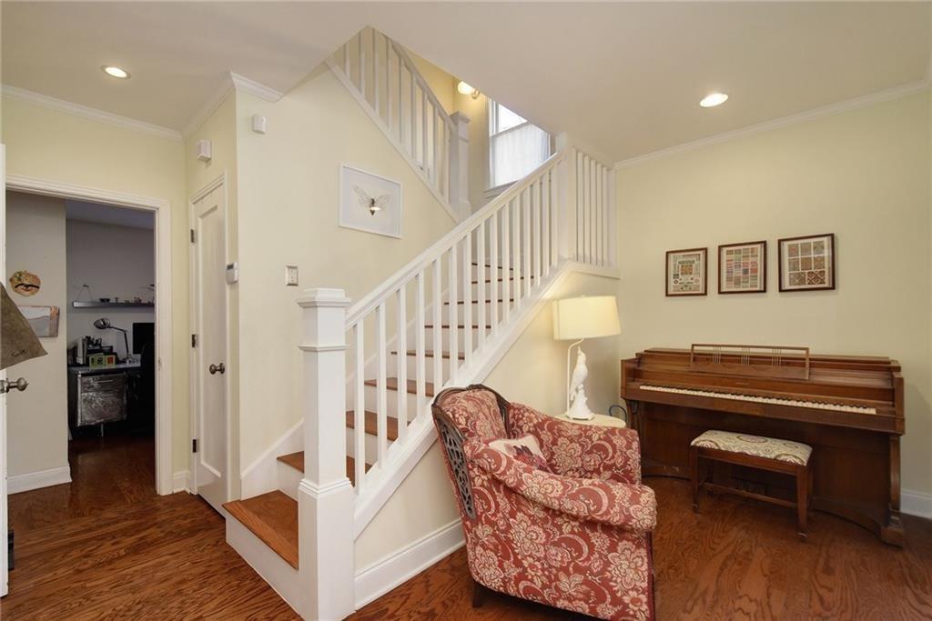 4412 Barrow Avenue, Unit A Austin, TX 78751 - Photo 13 of 28 Stairway with ornamental molding, wood finished floors, and recessed lighting