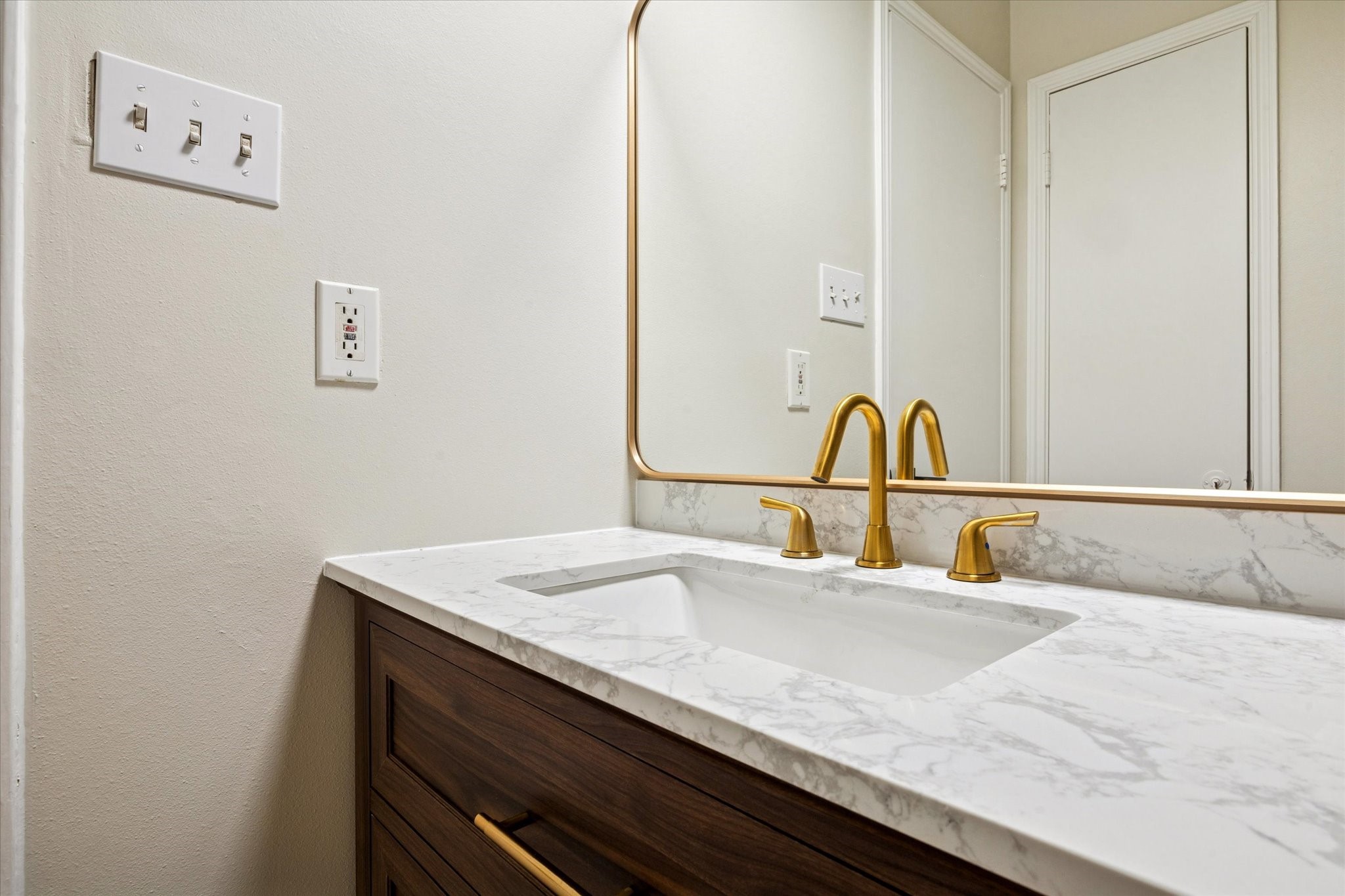 2100 Tanglewilde Street, Unit 195 Houston, TX 77063 - Photo 14 of 34 a bathroom with a sink and a mirror