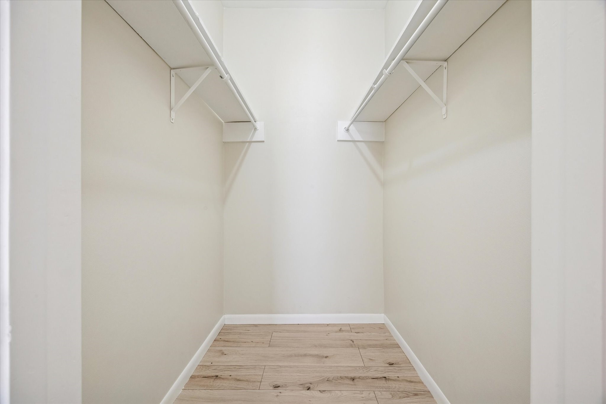 2100 Tanglewilde Street, Unit 195 Houston, TX 77063 - Photo 17 of 34 a view of a room with racks on the wall