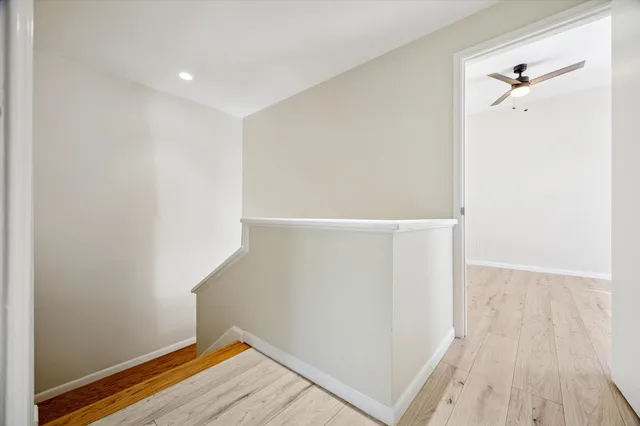 a bathroom with a double vanity sink and a toilet