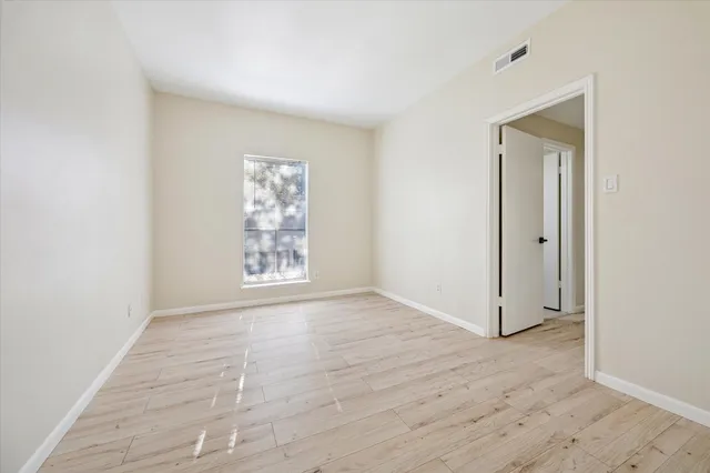 a white toilet sitting next to a shower curtain
