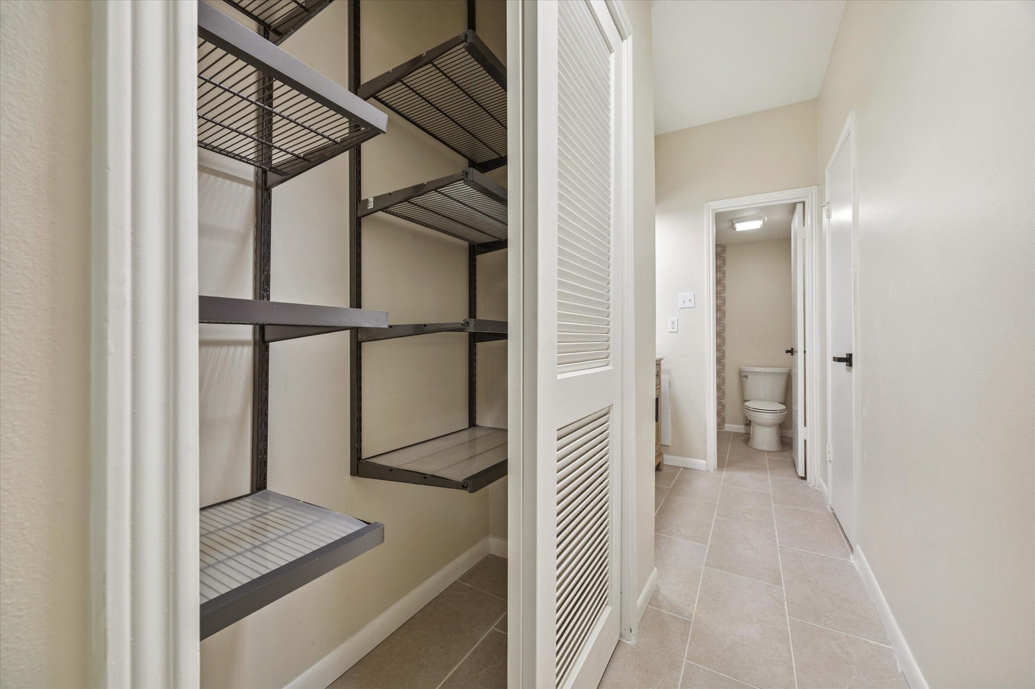 2100 Tanglewilde Street, Unit 195 Houston, TX 77063 - Photo 26 of 34 a view of a hallway with wooden floor and staircase