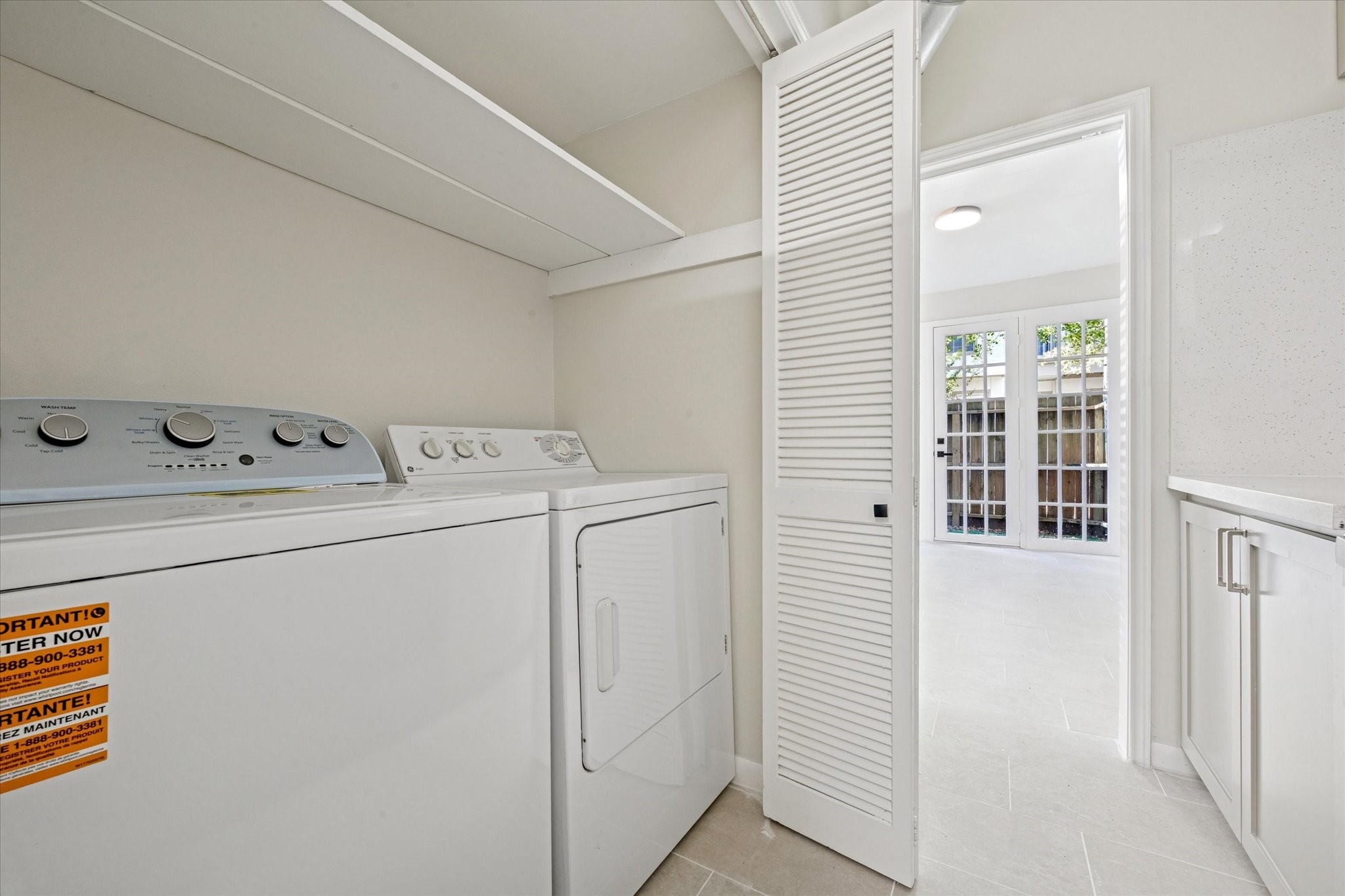2100 Tanglewilde Street, Unit 195 Houston, TX 77063 - Photo 28 of 34 a utility room with dryer and washer