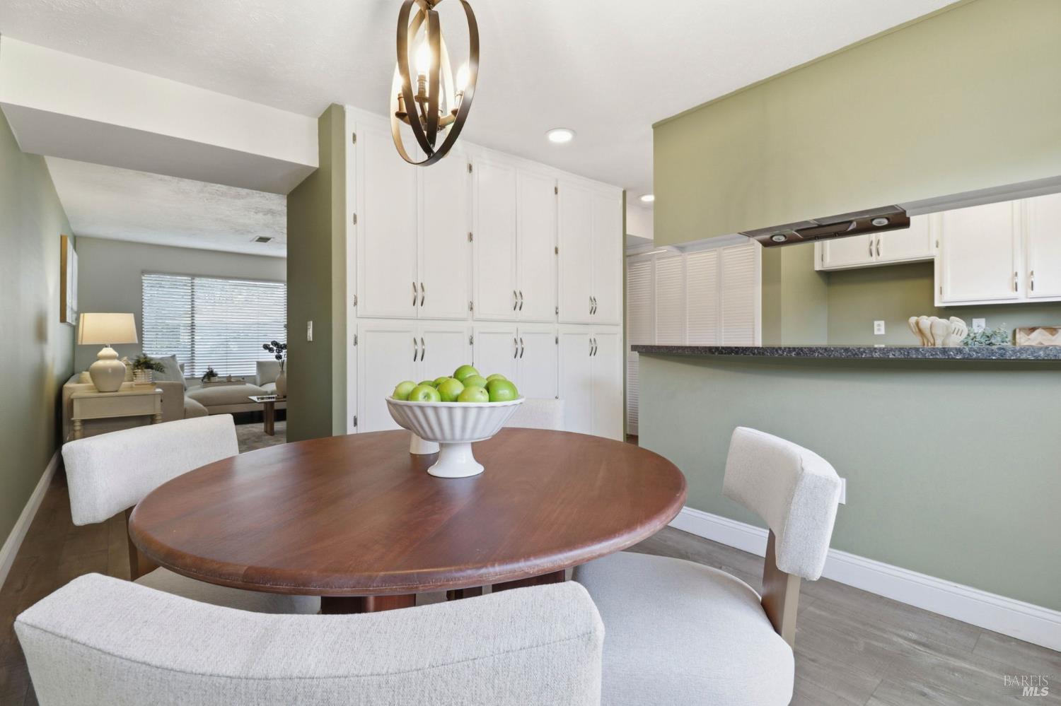 19167 Robinson Road, Unit H Sonoma, CA 95476 - Photo 12 of 32 a dining room with furniture and wooden floor
