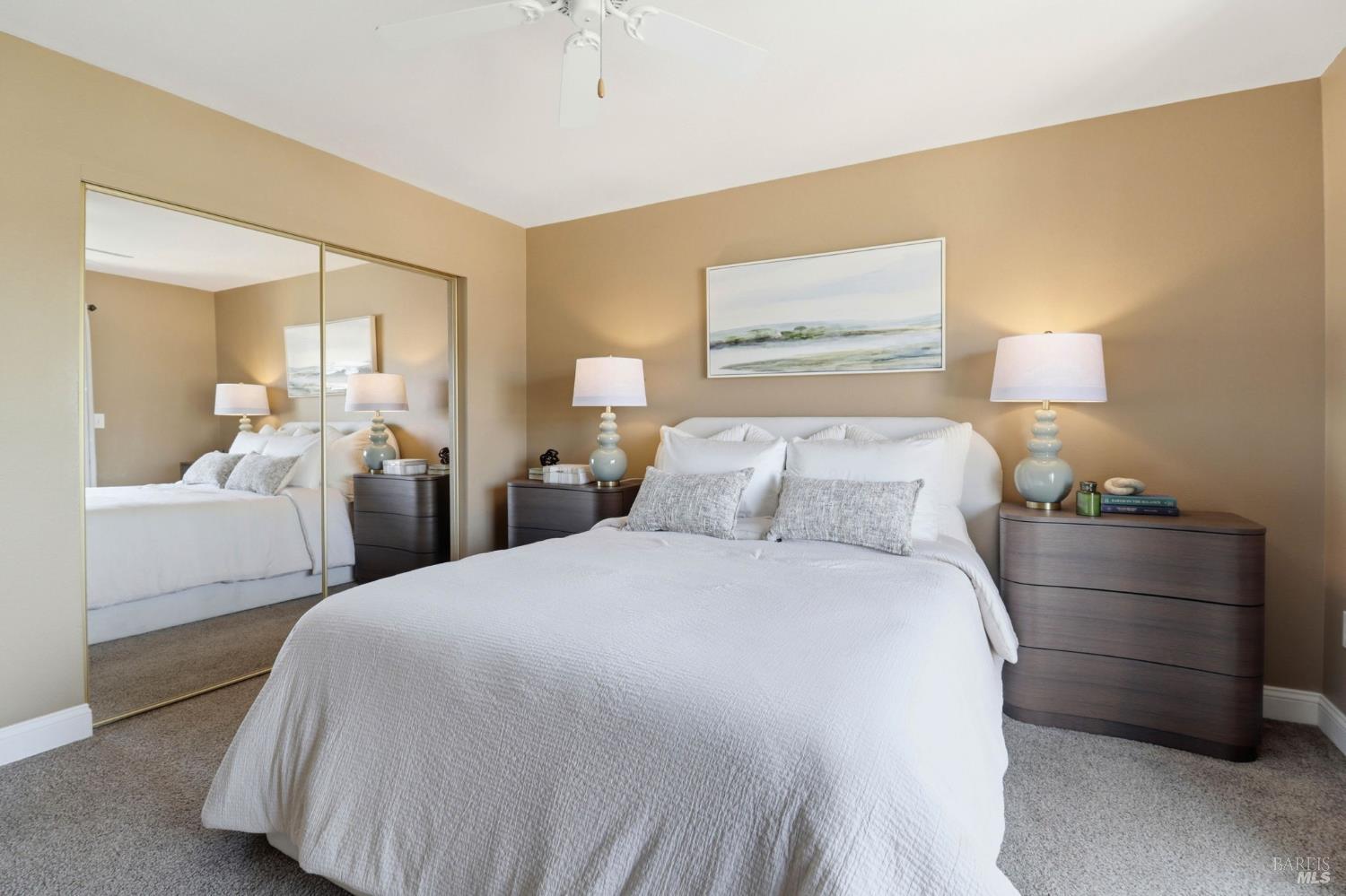 19167 Robinson Road, Unit H Sonoma, CA 95476 - Photo 15 of 32 a bedroom with a bed and a mirror