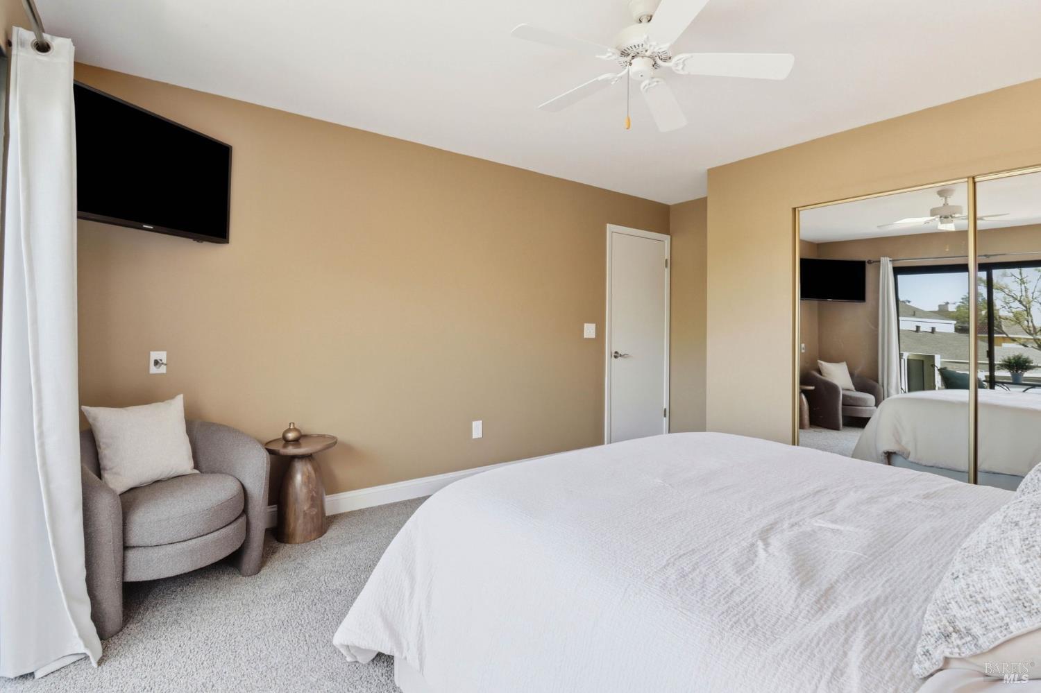 19167 Robinson Road, Unit H Sonoma, CA 95476 - Photo 18 of 32 a bedroom with a bed and a flat screen tv