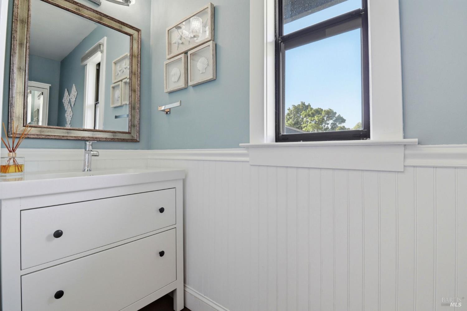 19167 Robinson Road, Unit H Sonoma, CA 95476 - Photo 23 of 32 a bathroom with a sink and a mirror