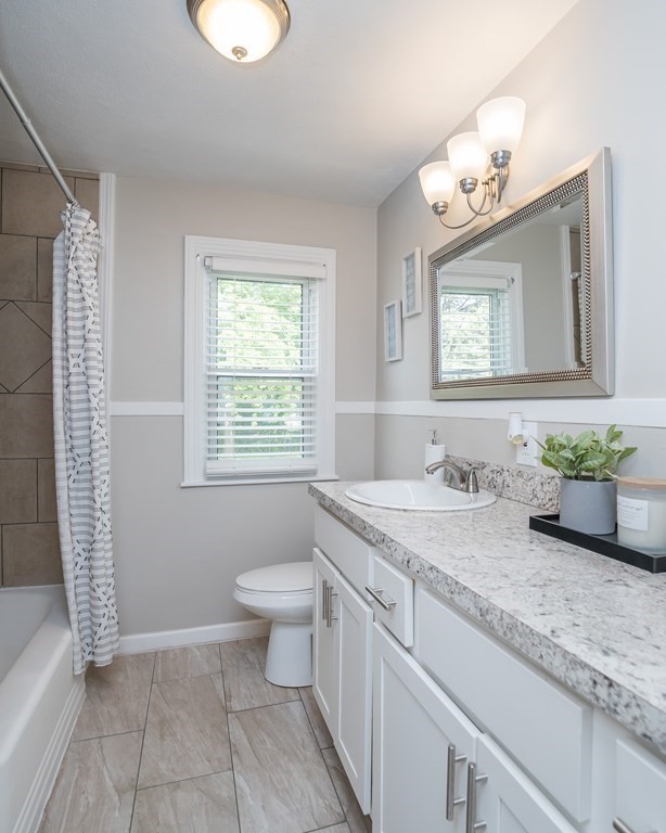 185 Pasco Road Springfield, MA 01151 - Photo 11 of 34 a bathroom with a granite countertop sink and a mirror