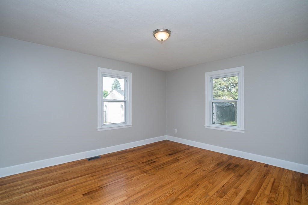 185 Pasco Road Springfield, MA 01151 - Photo 14 of 34 a view of empty room with wooden floor and fan
