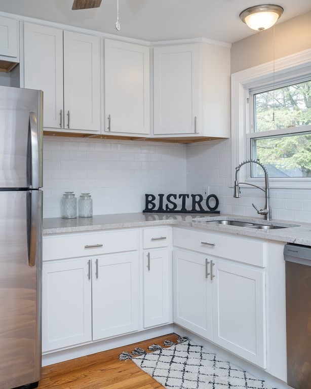185 Pasco Road Springfield, MA 01151 - Photo 3 of 34 a kitchen with stainless steel appliances granite countertop a sink a stove a refrigerator and cabinets