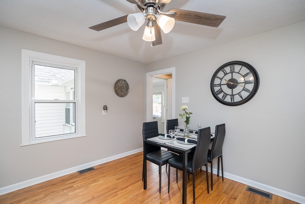 185 Pasco Road Springfield, MA 01151 - Photo 4 of 34 a view of a dining room with furniture and a chandelier