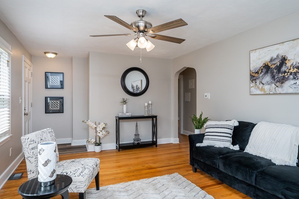185 Pasco Road Springfield, MA 01151 - Photo 8 of 34 a living room with furniture a fireplace and a large window