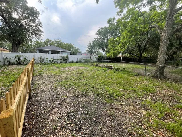 a backyard of a house with lots of green space