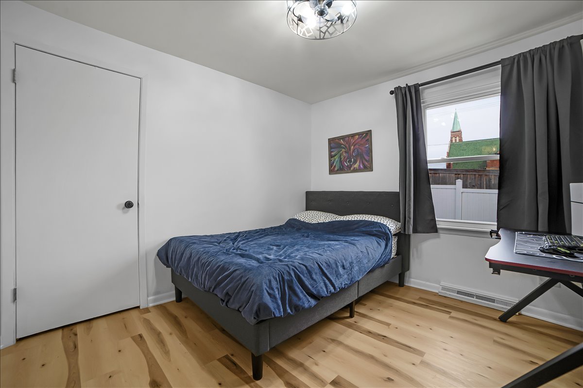 705 State Street Lemont, IL 60439 - Photo 11 of 31 a bedroom with a bed dresser and a window