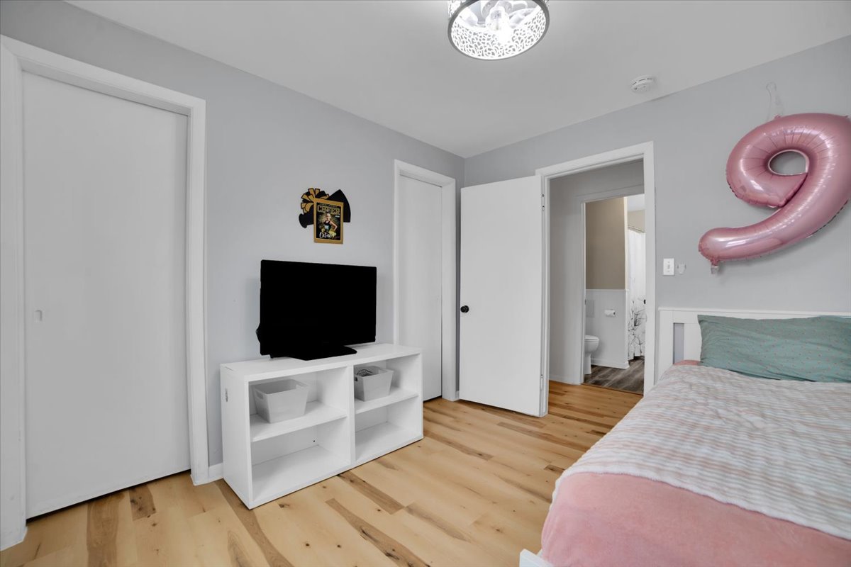 705 State Street Lemont, IL 60439 - Photo 14 of 31 a bedroom with furniture and flat screen tv