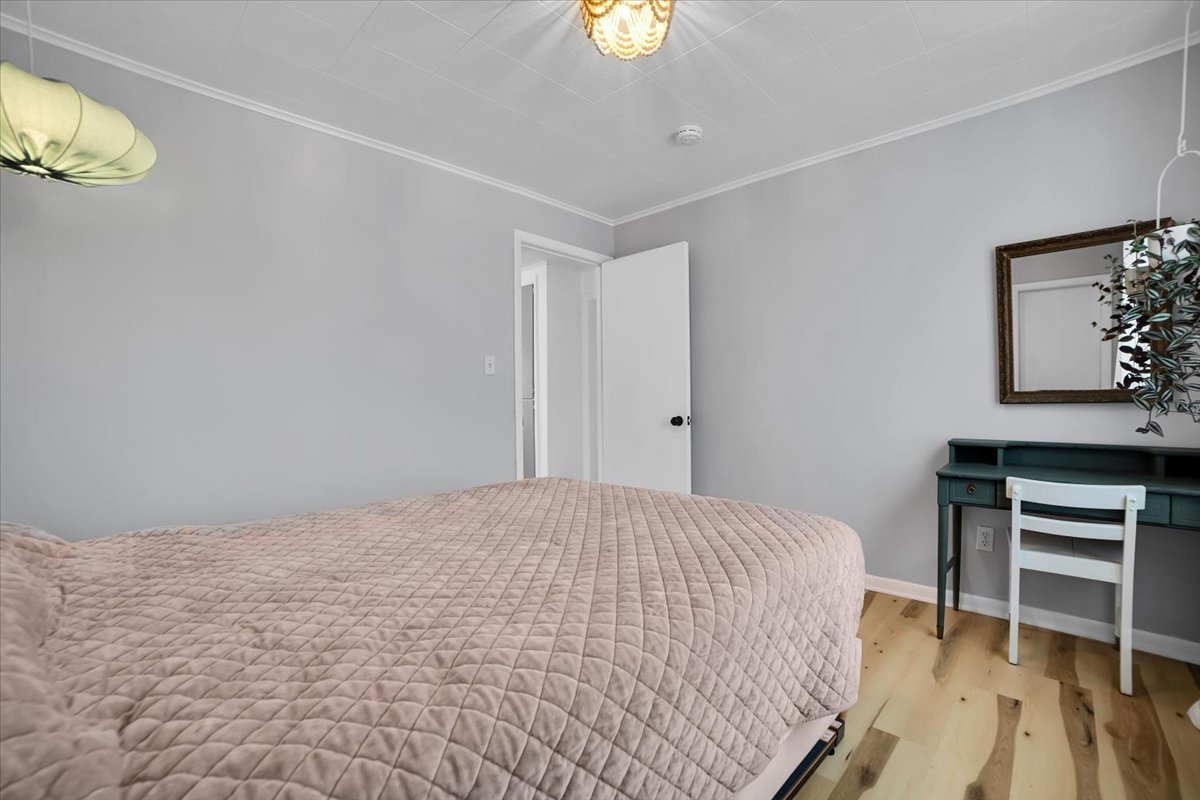 705 State Street Lemont, IL 60439 - Photo 19 of 31 a bedroom with a bed and a desk