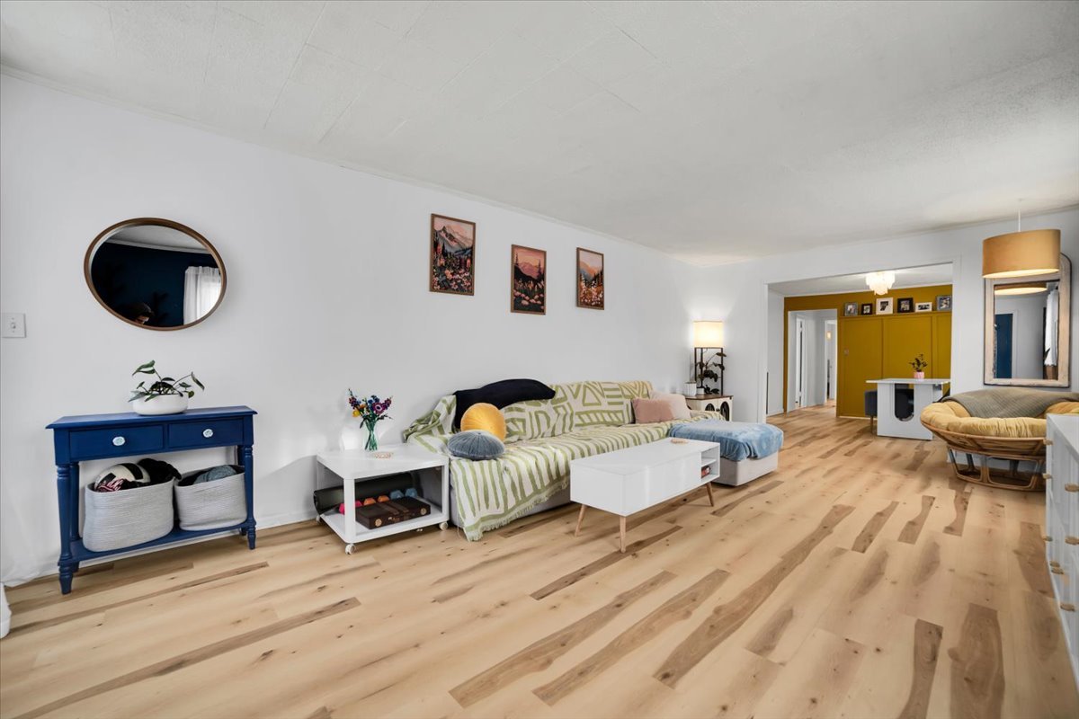 705 State Street Lemont, IL 60439 - Photo 3 of 31 a living room with furniture and a wooden floor