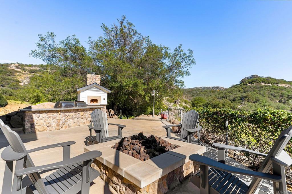 14671 Mussey Grade Road Ramona, CA 92065 - Photo 12 of 36 a view of a chairs and table on the terrace