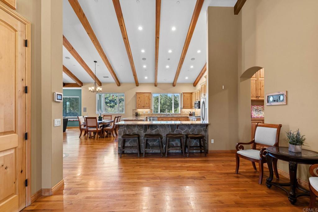 14671 Mussey Grade Road Ramona, CA 92065 - Photo 13 of 36 a view of dining room with furniture window and wooden floor