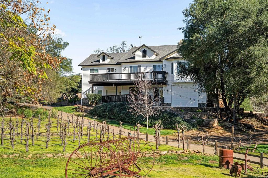 14671 Mussey Grade Road Ramona, CA 92065 - Photo 2 of 36 a view of a house with garden