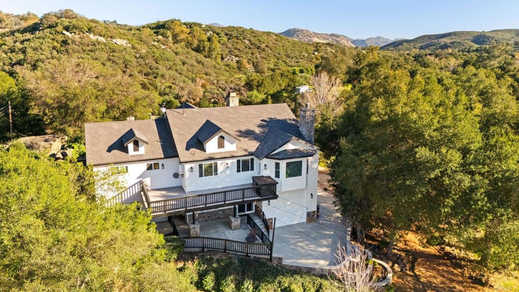 14671 Mussey Grade Road Ramona, CA 92065 - Photo 23 of 36 an aerial view of a house with a mountain