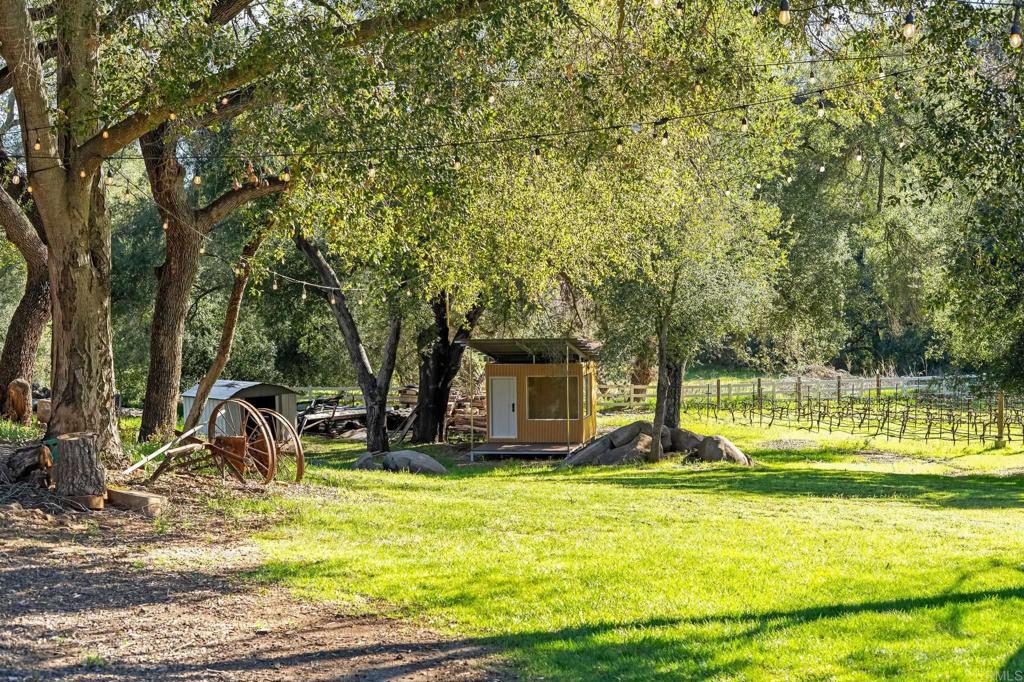 14671 Mussey Grade Road Ramona, CA 92065 - Photo 34 of 36 a view of a swimming pool with a patio and a yard
