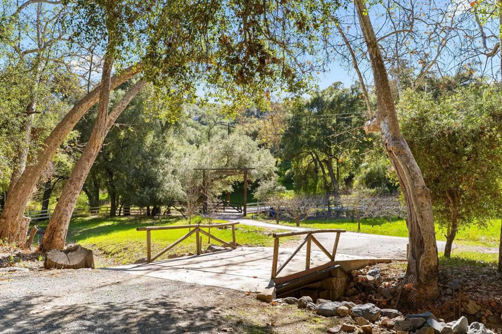 14671 Mussey Grade Road Ramona, CA 92065 - Photo 7 of 36 a view of a swimming pool with a backyard