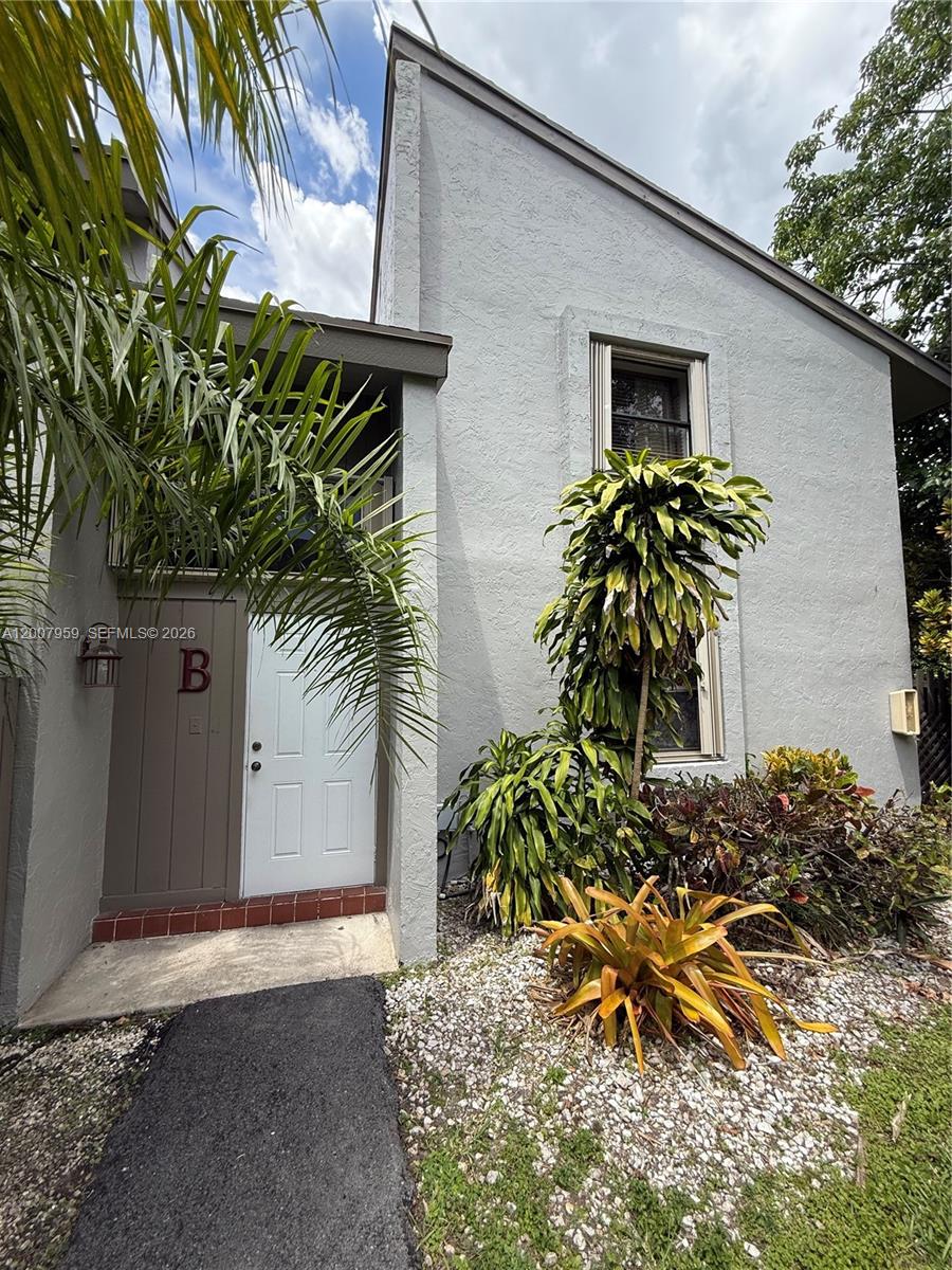a view of a house with a tree