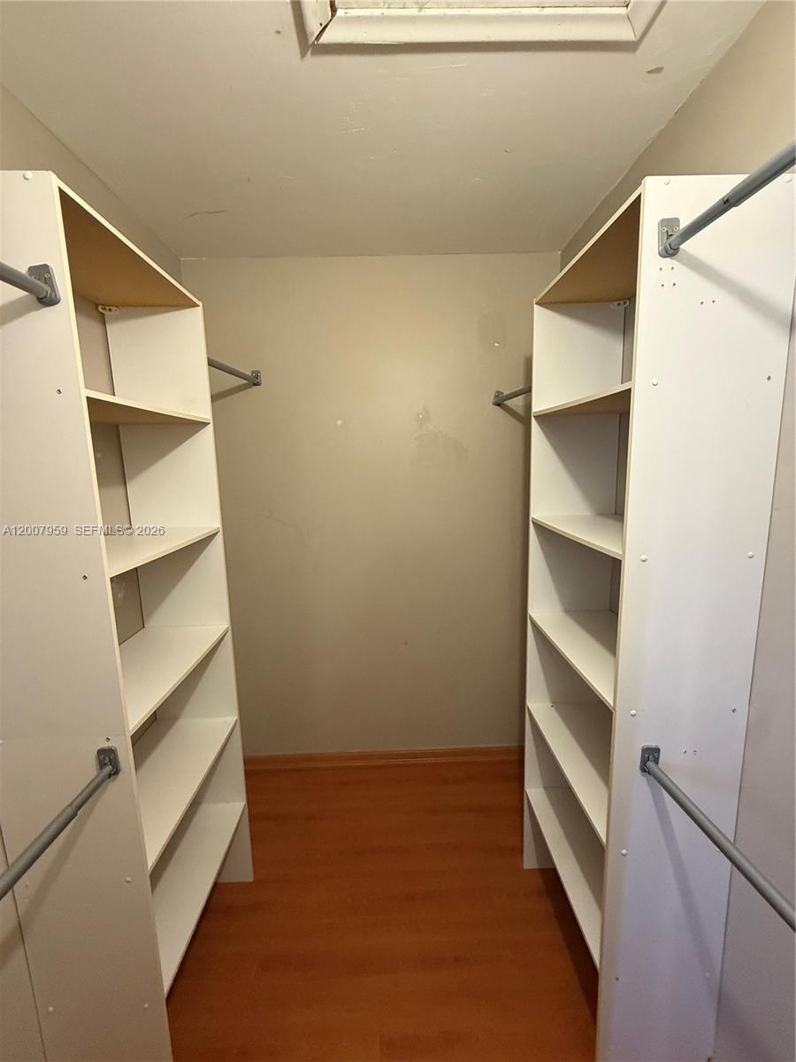 10661 Southwest 113th Place, Unit 94B Miami, FL 33176 - Photo 28 of 54 a view of an empty walk in closet