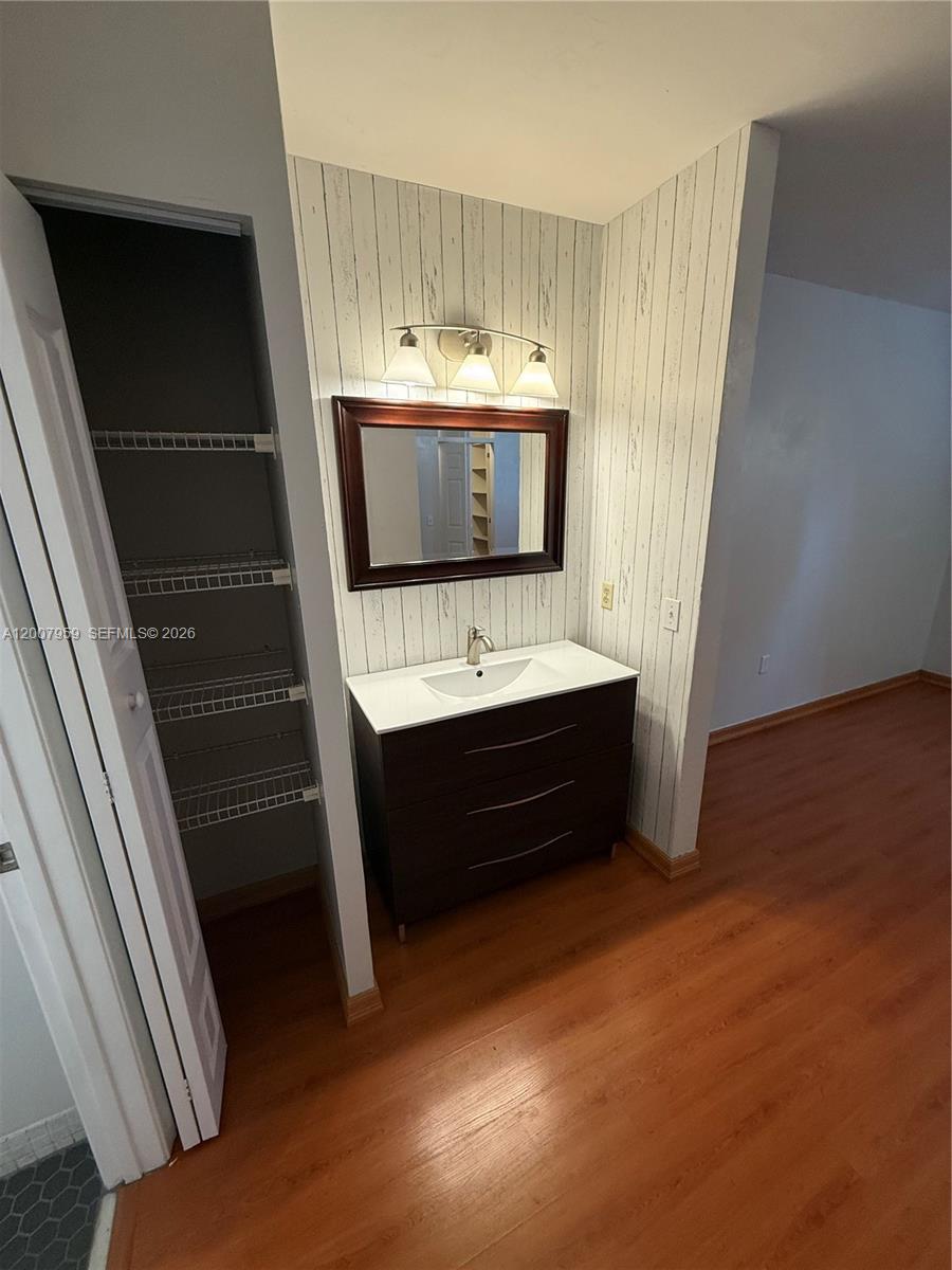10661 Southwest 113th Place, Unit 94B Miami, FL 33176 - Photo 30 of 54 a bathroom with a double vanity sink and mirror