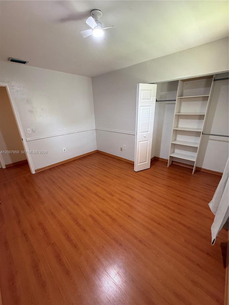 10661 Southwest 113th Place, Unit 94B Miami, FL 33176 - Photo 36 of 54 wooden floor in an empty room with a window